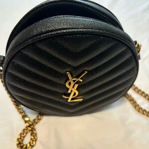 YSL round quilted crossbody bag.